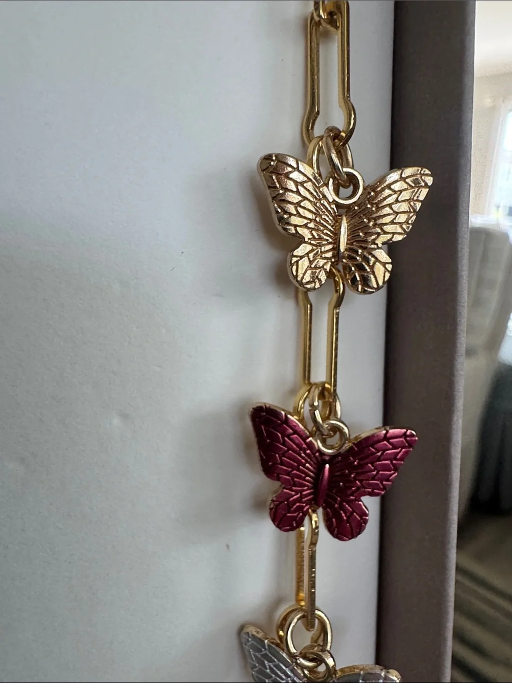 Gold Butterfly Pendant Necklace with Red and Silver Accents